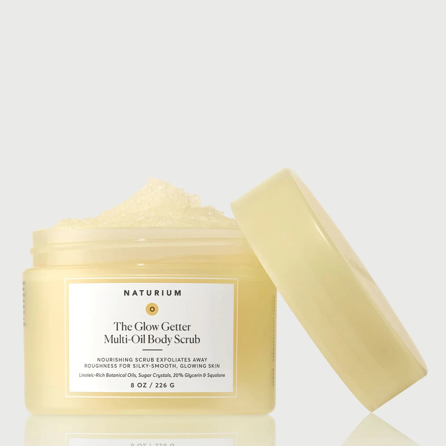 the-glow-getter-multi-oil-body-scrub-i7 NATR-40028-GlowGetter-Multi-Oil-Body-Scrub-Front-CapOff-bonebkgd.webp