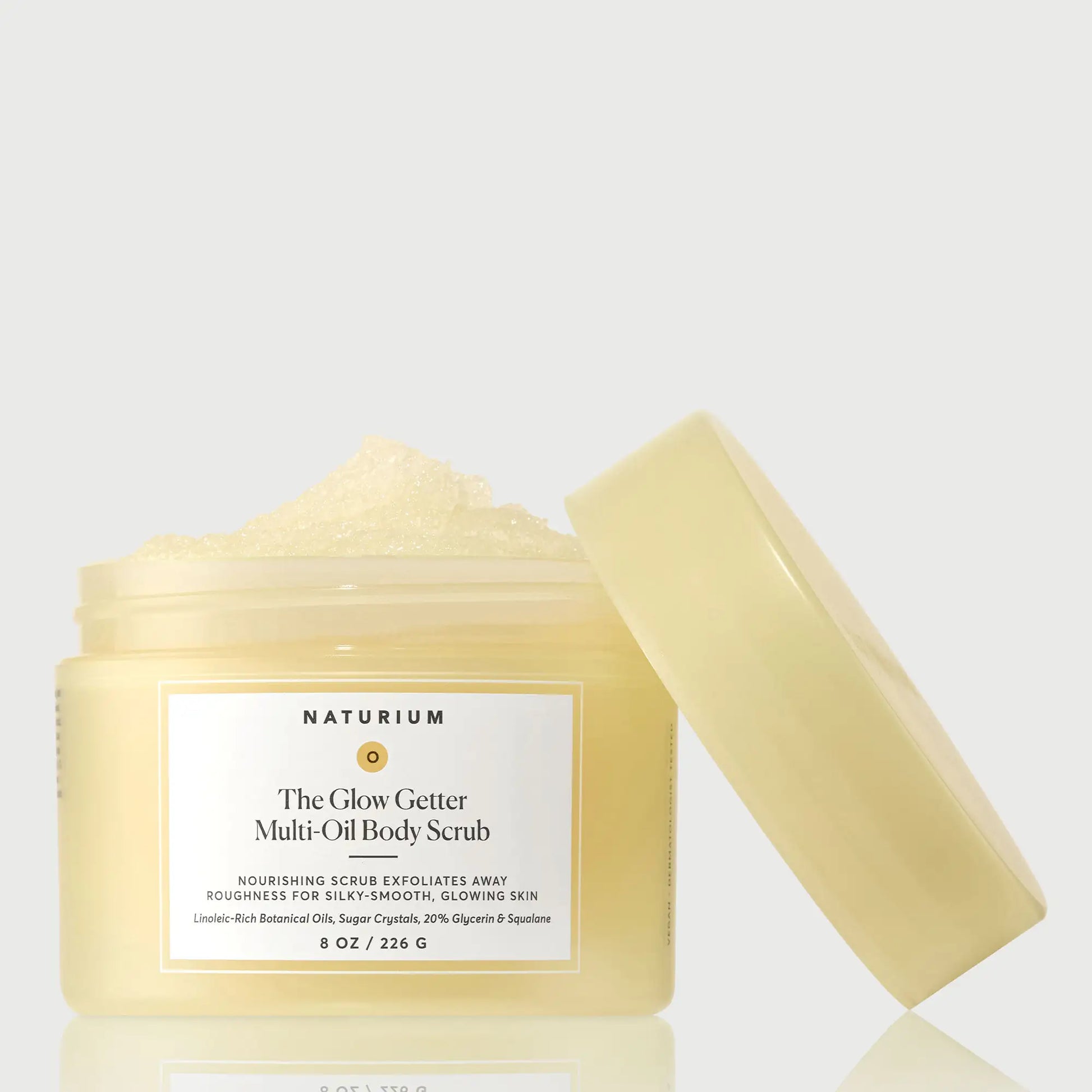 the-glow-getter-multi-oil-body-scrub-i7 NATR-40028-GlowGetter-Multi-Oil-Body-Scrub-Front-CapOff-bonebkgd.webp